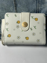 White wallet with flowers