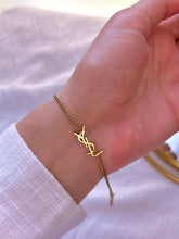 Ysl insial in gold