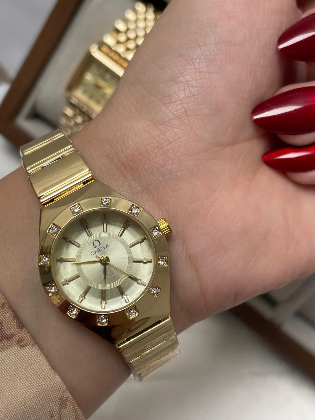 Omega Round gold watch