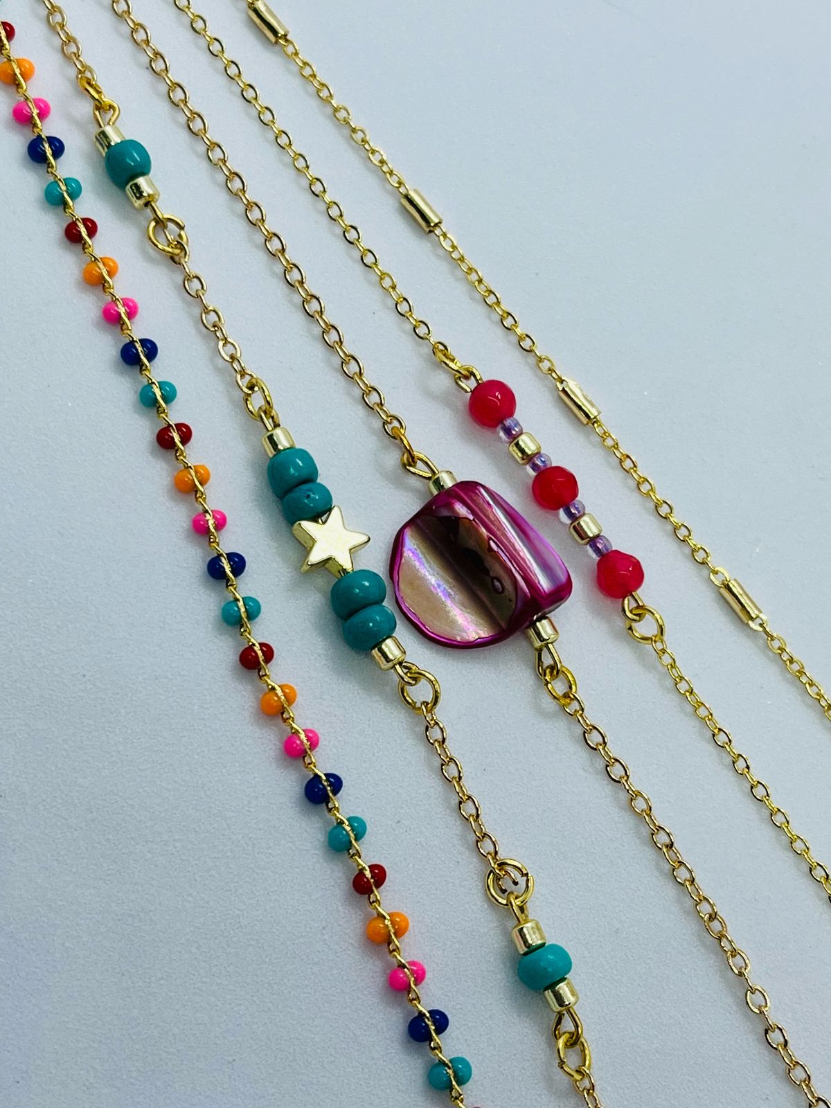 Gold Tone Layering Bracelets with Beads and Charms